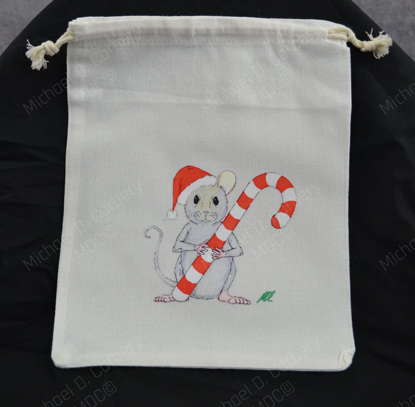 Santa Mouse holding a candy cane gift bag